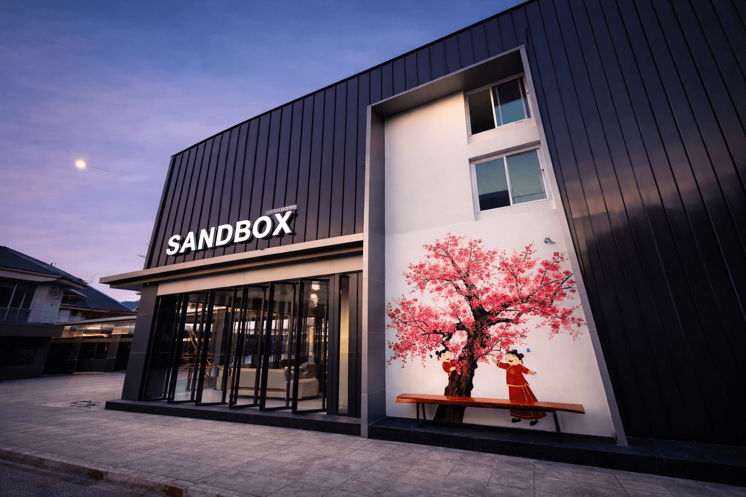 Landscaped hotel frontage with flowers and greenery