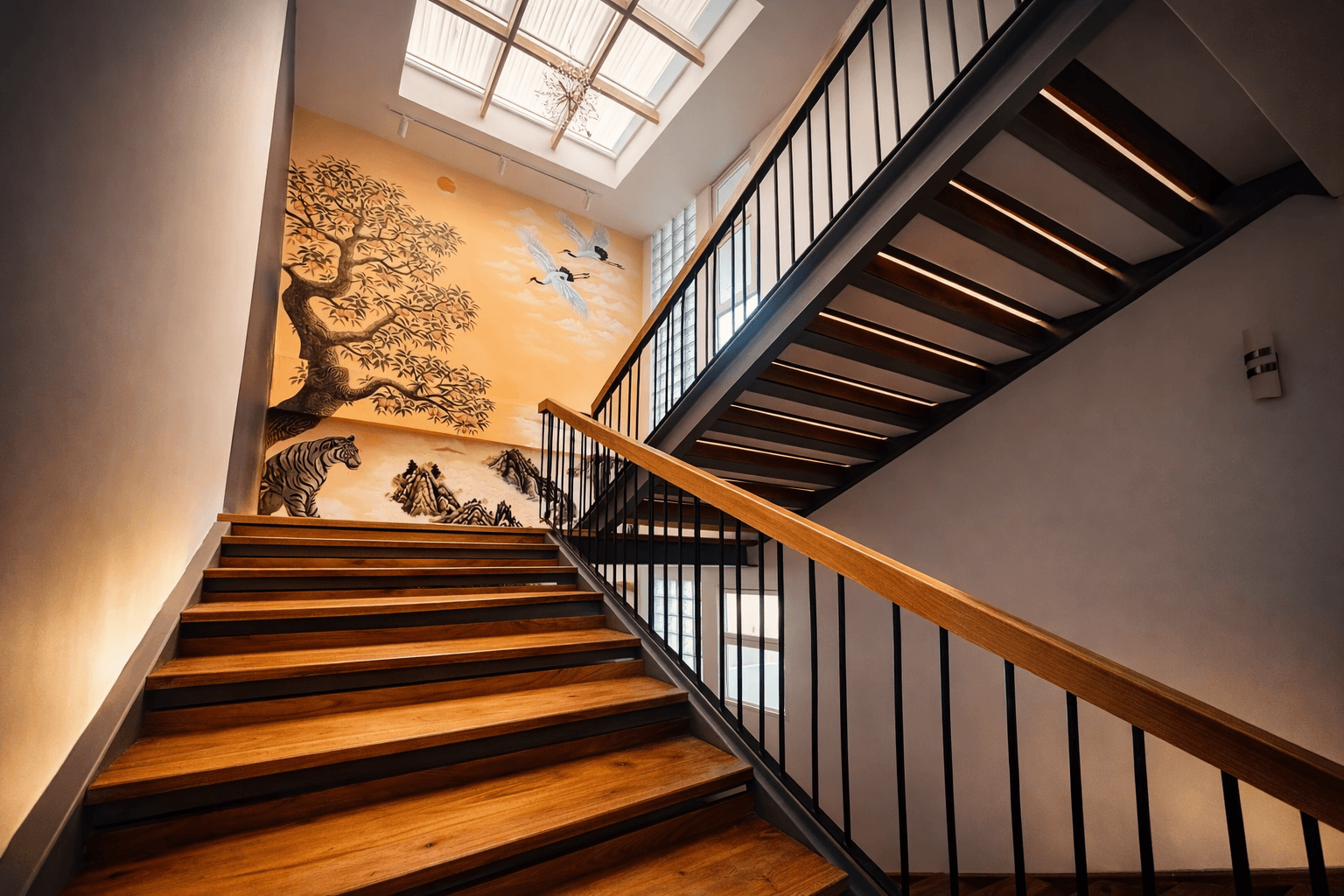 Interior staircase with mural details inside Sandbox Hotel